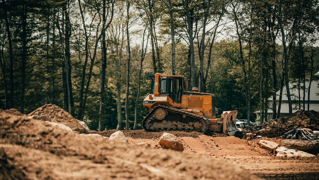 yellow-and-black-heavy-equipment-on-brown-soil-twptj-b6iqm